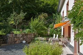Sun-drenched terrace of the Appartement Forestier Holidays in the Vosges